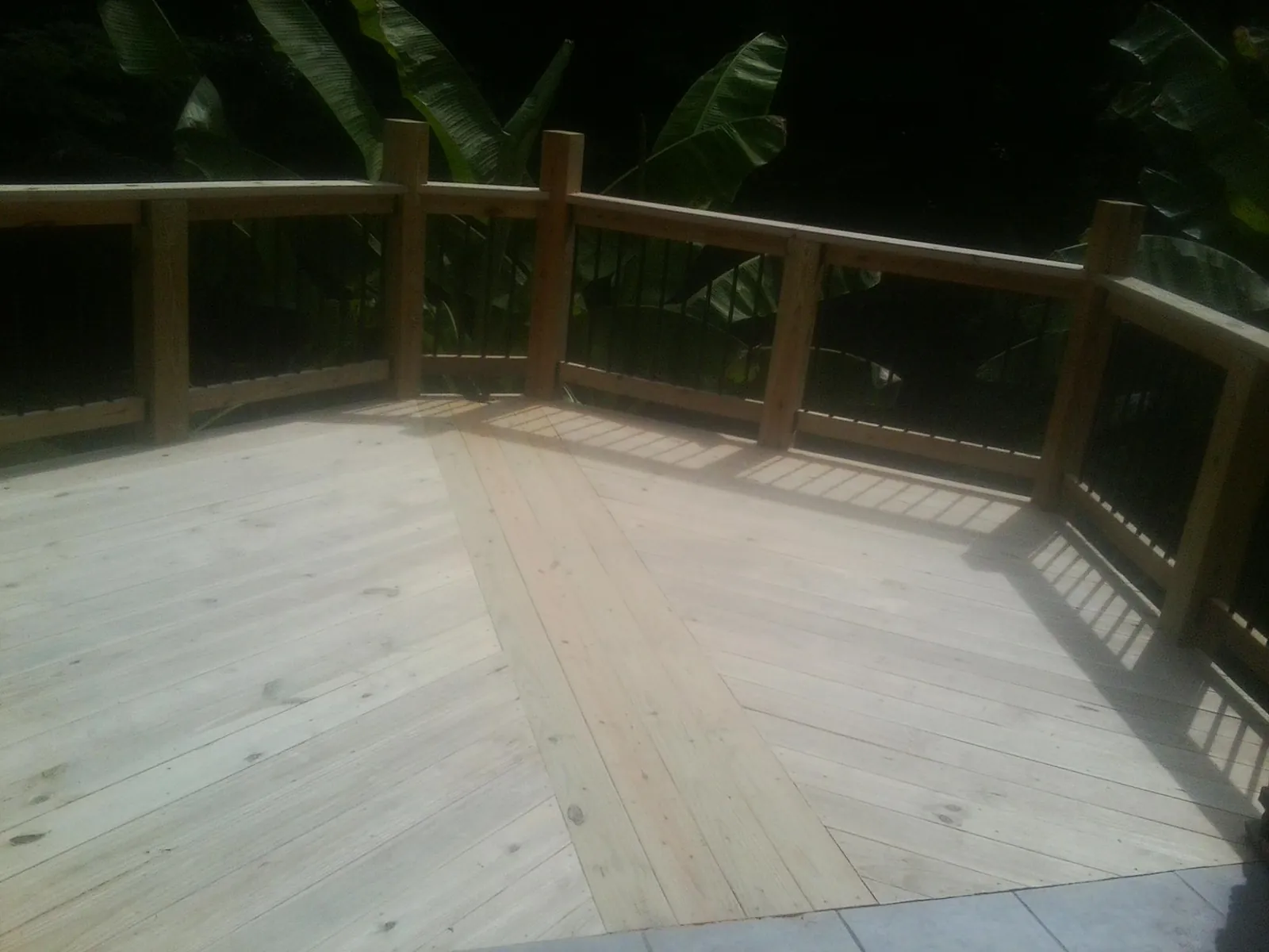 New wood deck and railing built off the back of a home in Vernal